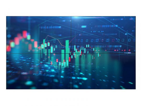 Philips 65BDL6005X/00 65 Inch UHD Signage Video Wall Display showing a vibrant financial stock chart with candlestick patterns, multicolored line graphs, and binary code backdrop, ideal for professional market analysis presentations.