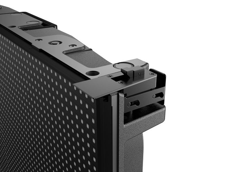 Close-up image of Unilumin URMIII 2.6 MK2 Pro LED wall module, showing a 2.6mm pixel pitch grid of tiny LED lights and a section of the sturdy metal frame with visible attachment and mounting mechanisms for seamless video wall installation.