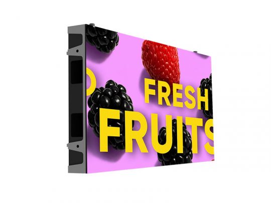 Digital screen displaying FRESH FRUITS in bold yellow letters on a pink background, with blackberries and a raspberry pictured; side angled view of the display.