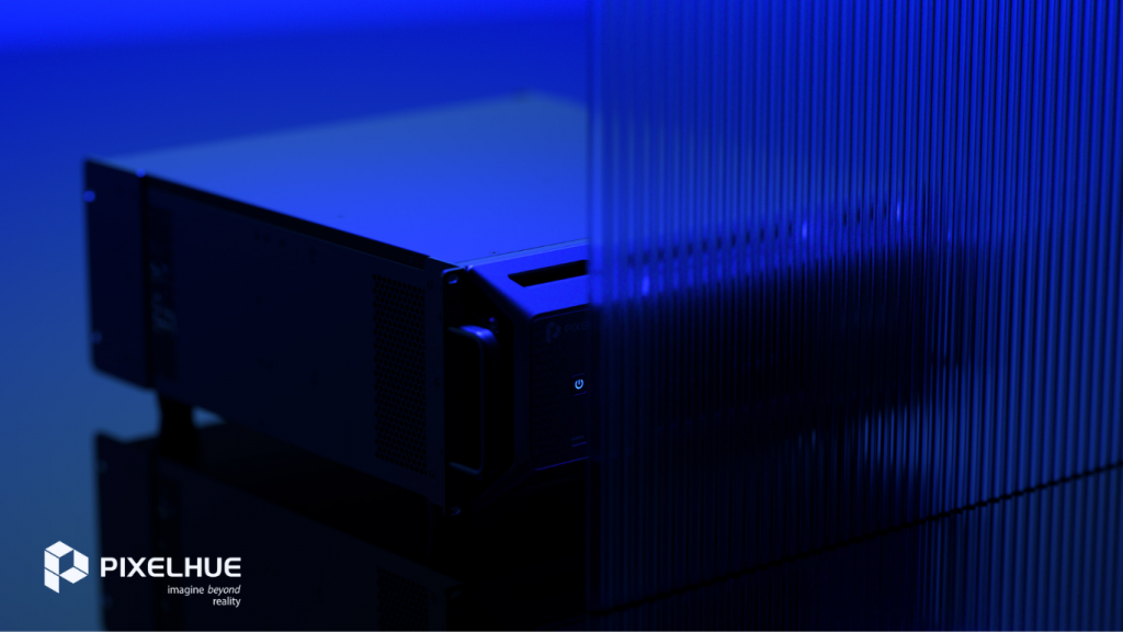 Pixelhue server behind a translucent ribbed blue panel, logo and "imagine beyond reality" text on dark background.